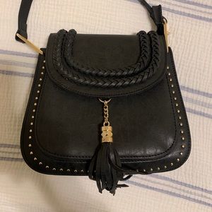 Black purse, brand unknown. Never used.